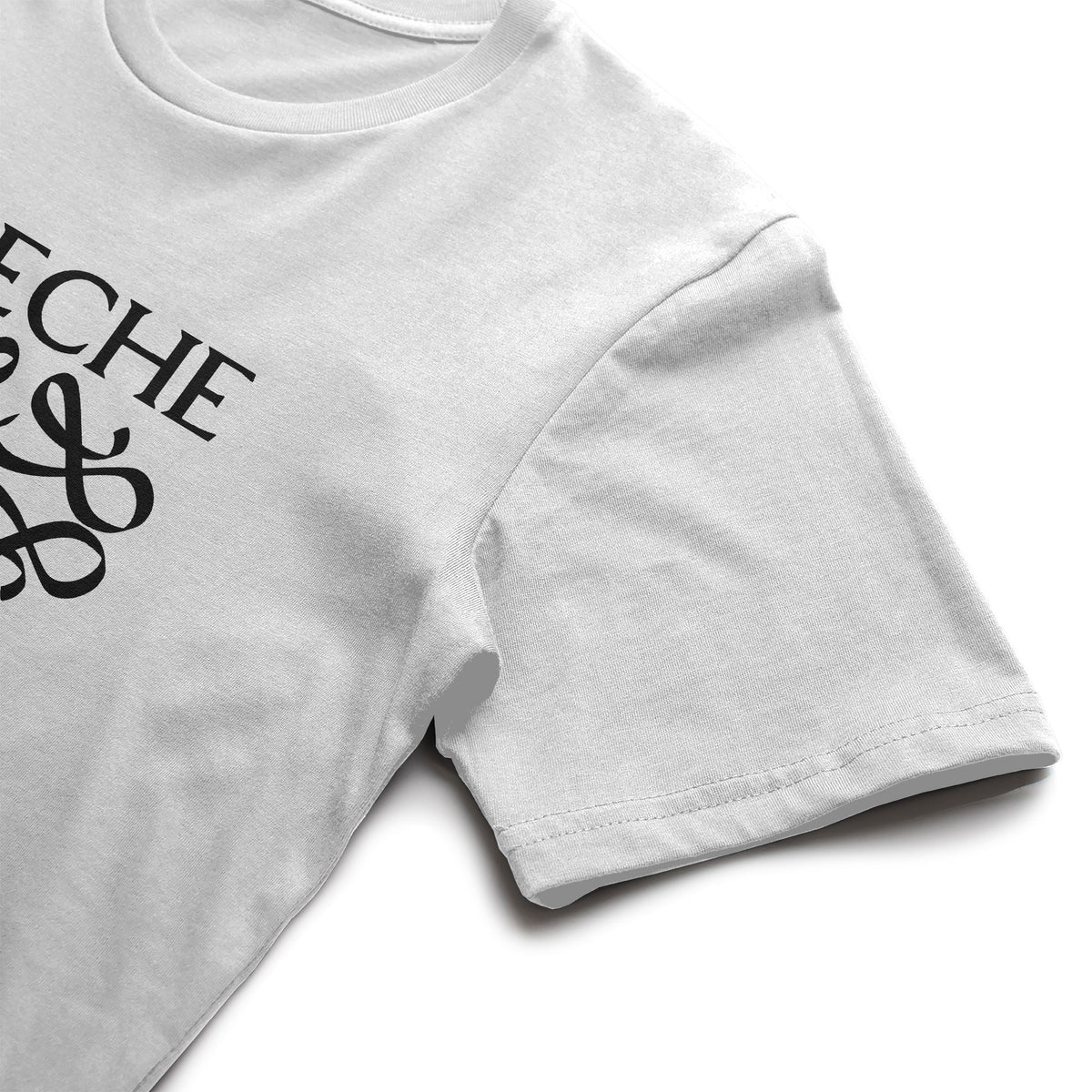 White adult tee with black Leche logo, folded